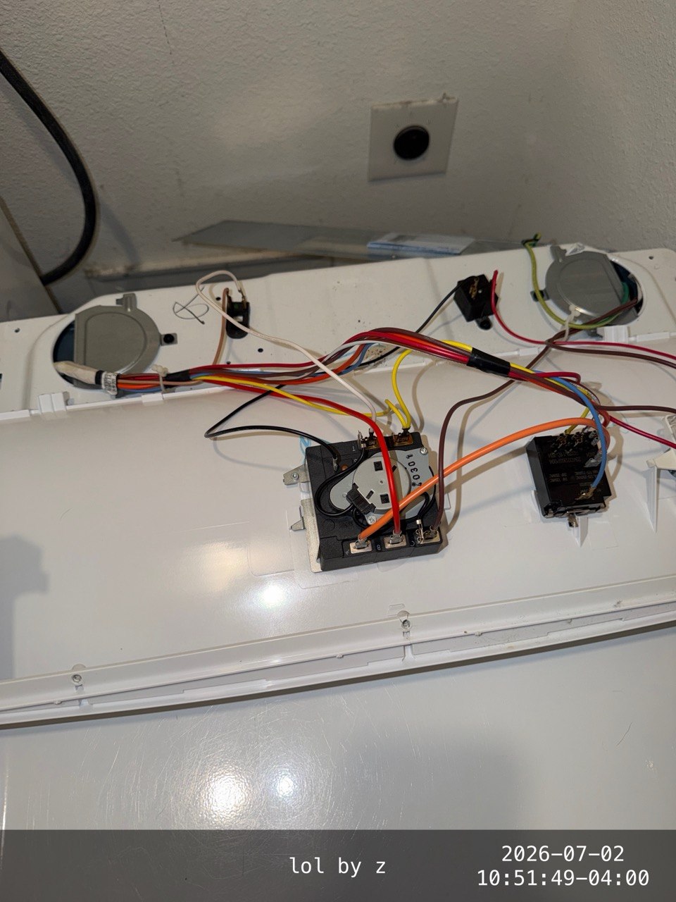 GE dryer timer and wiring during diagnosis in Davenport, Florida